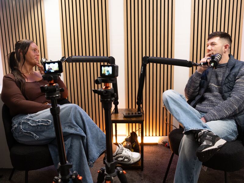 Podcast recording studio with microphones and seating